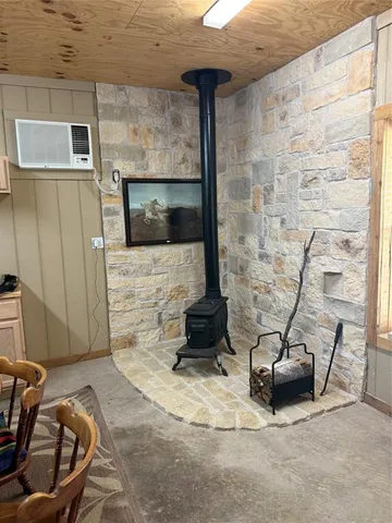 a balcony with furniture and a potted plant
