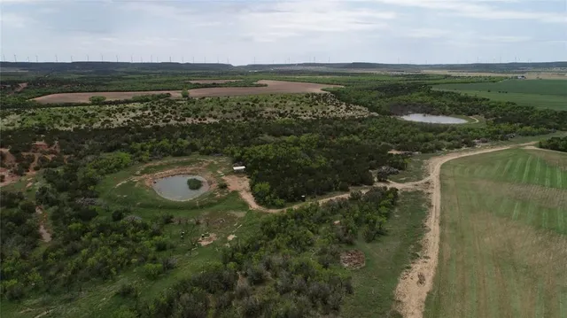 a view of a lake with a big yard