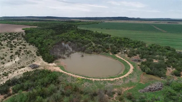 a view of a lake in middle of the house