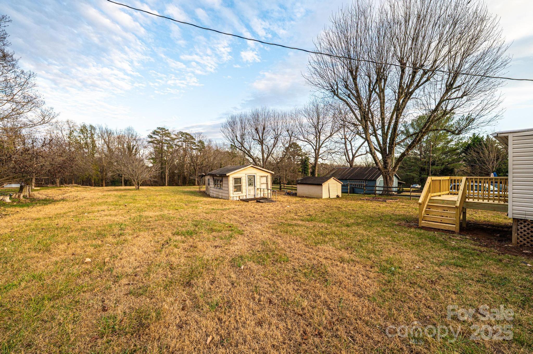 80 Duke Street Granite Falls, NC 28630 - Photo 13 of 48 a view of a yard with a house
