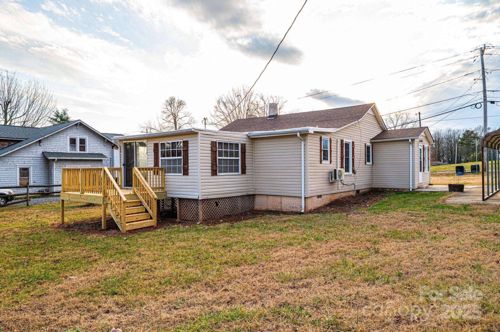 80 Duke Street Granite Falls, NC 28630 - Photo 14 of 48 a view of a house with a backyard