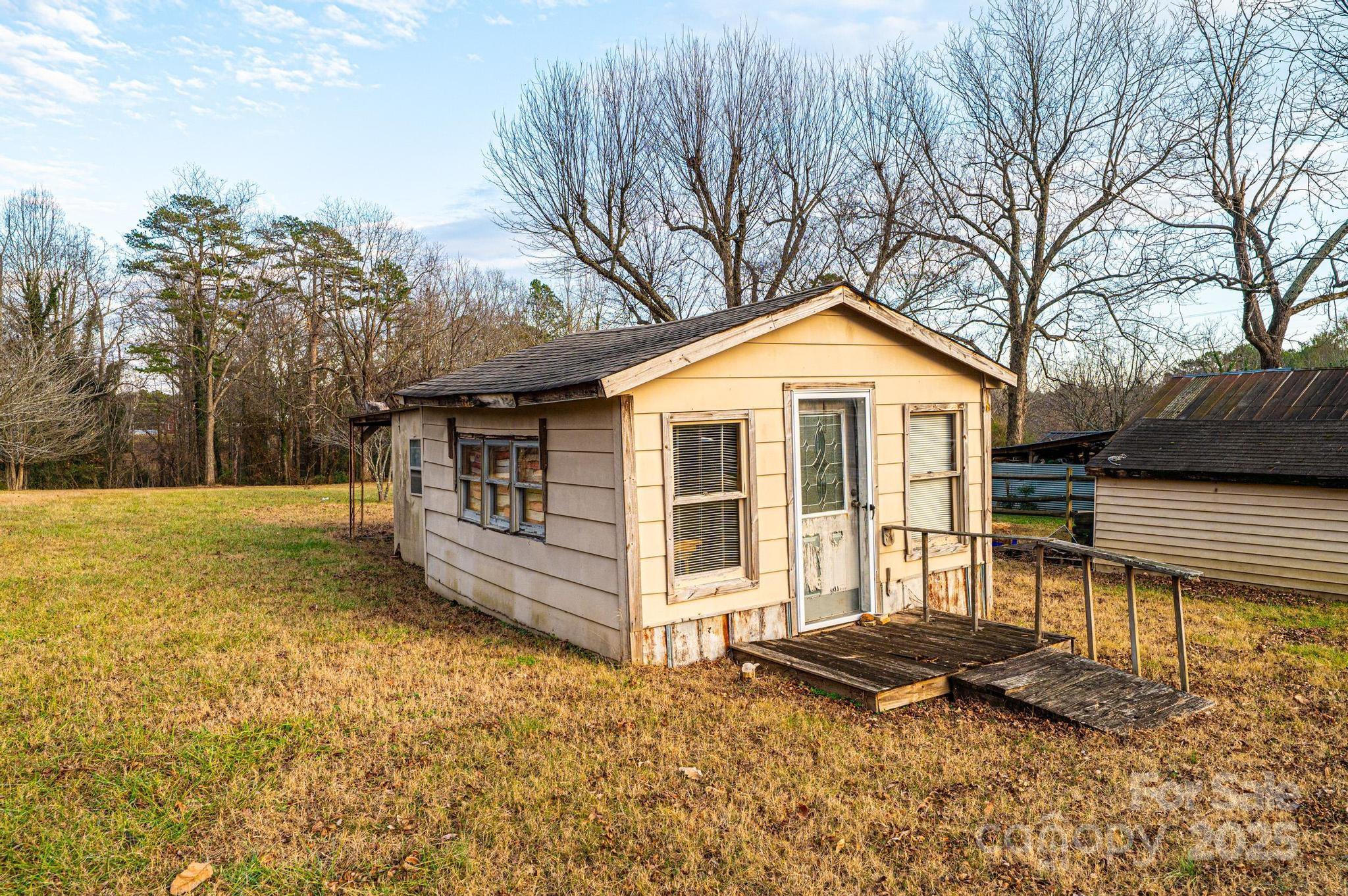 80 Duke Street Granite Falls, NC 28630 - Photo 15 of 48 a front view of a house with a yard