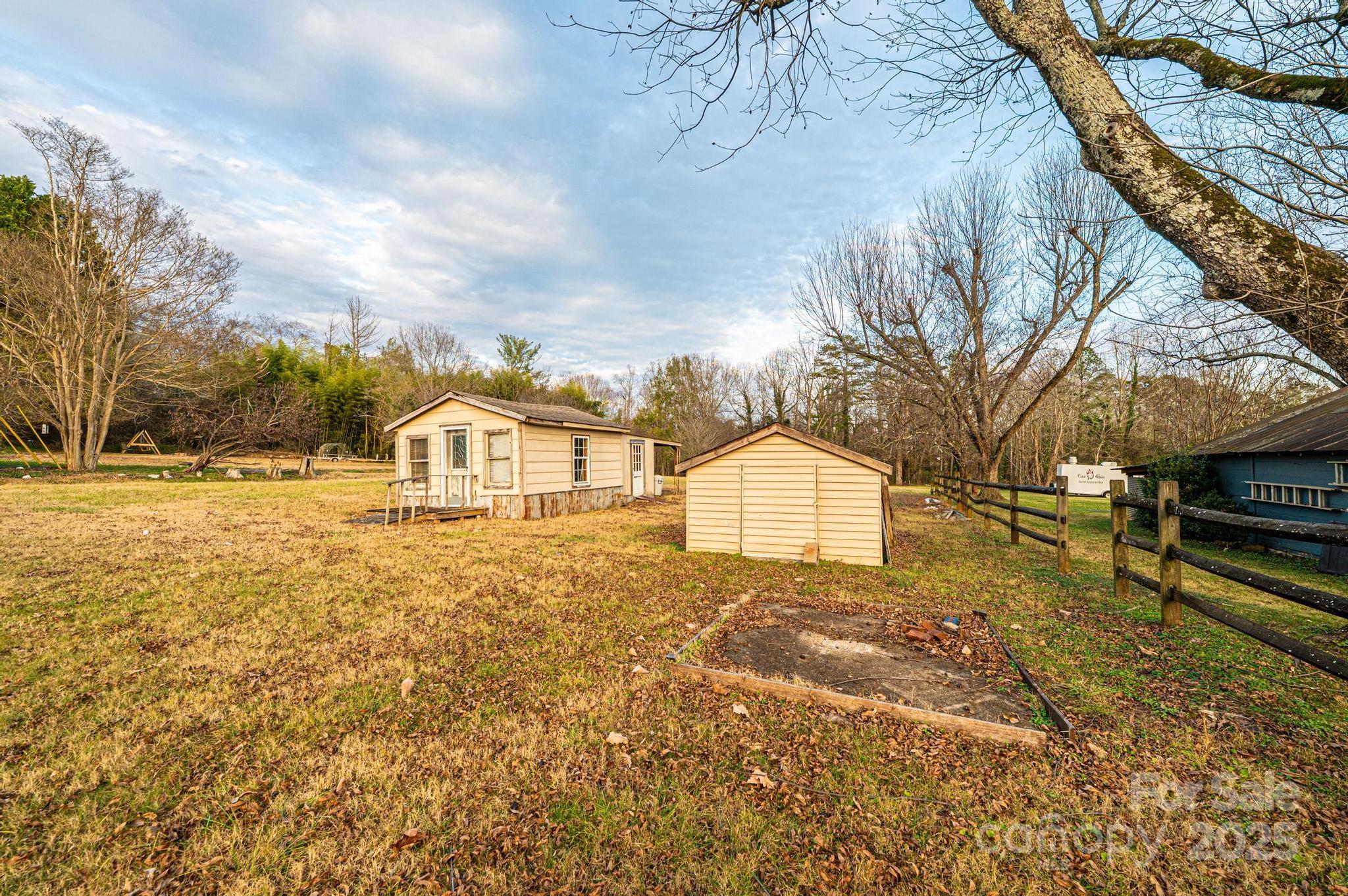 80 Duke Street Granite Falls, NC 28630 - Photo 18 of 48 a view of a yard with a house