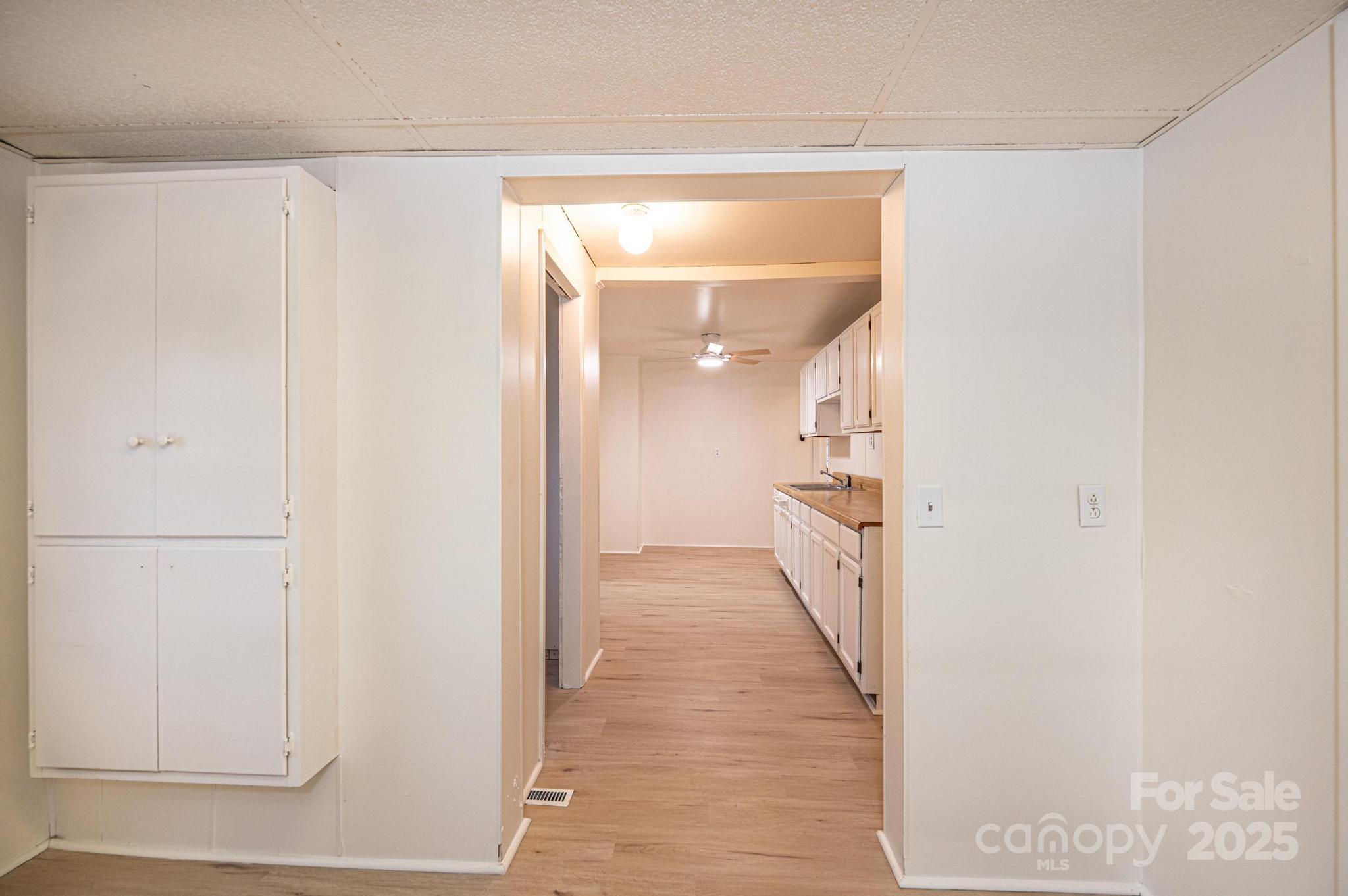 80 Duke Street Granite Falls, NC 28630 - Photo 38 of 48 a view of hallway with wooden floor