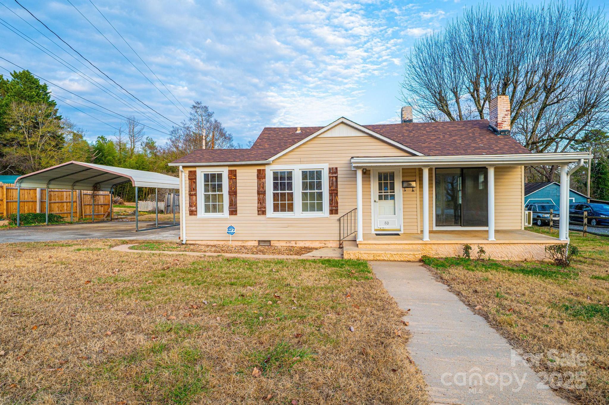 80 Duke Street Granite Falls, NC 28630 - Photo 4 of 48 a front view of a house with a garden