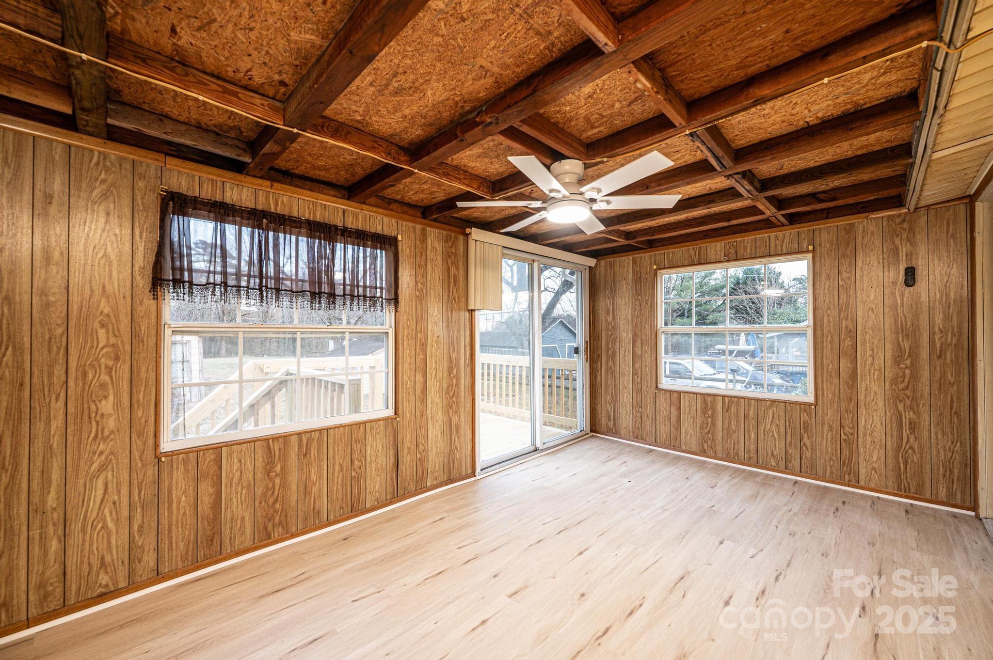 80 Duke Street Granite Falls, NC 28630 - Photo 42 of 48 a view of empty room with wooden floor and fan