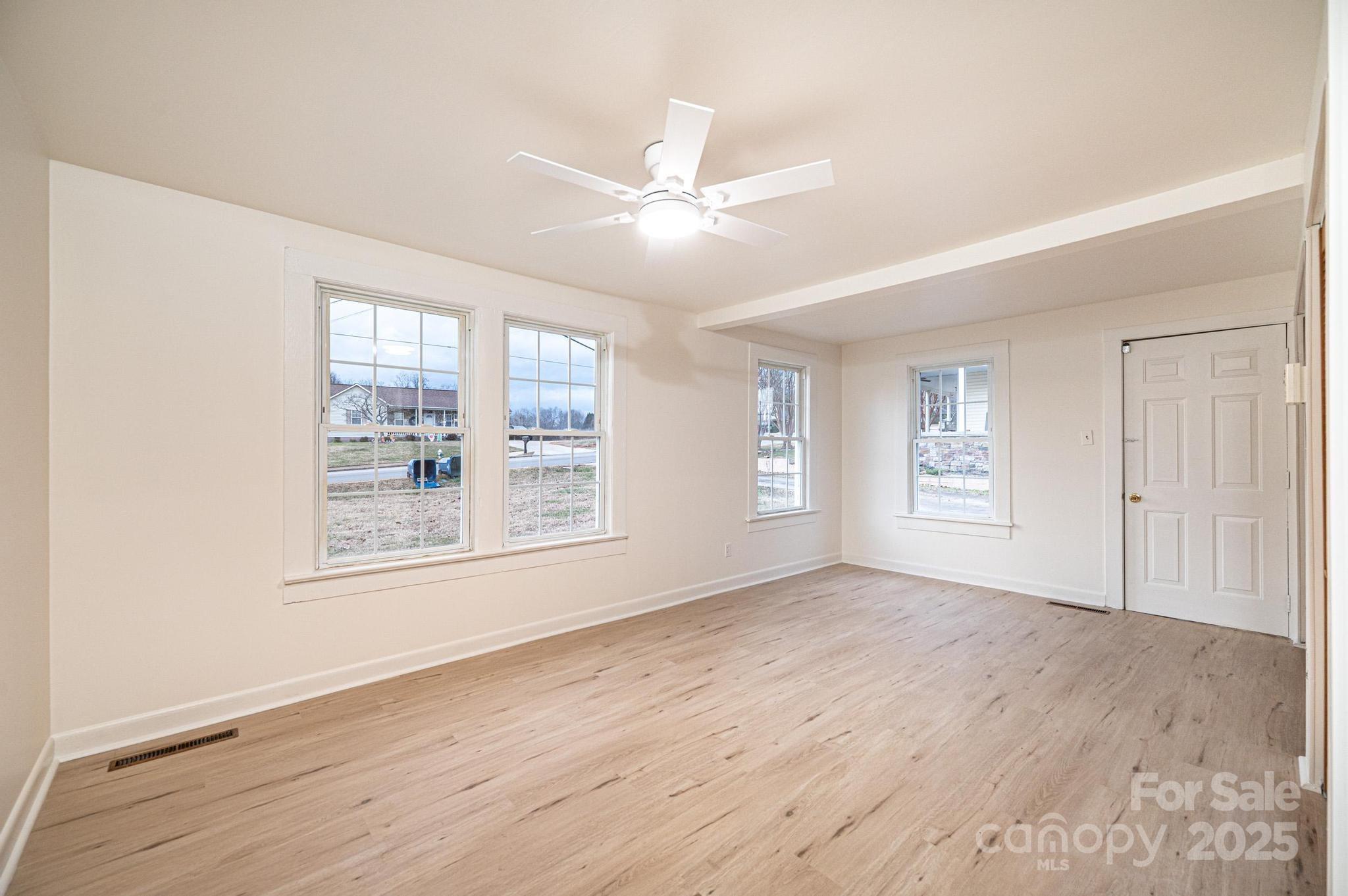 80 Duke Street Granite Falls, NC 28630 - Photo 43 of 48 wooden floor in an empty room with a window