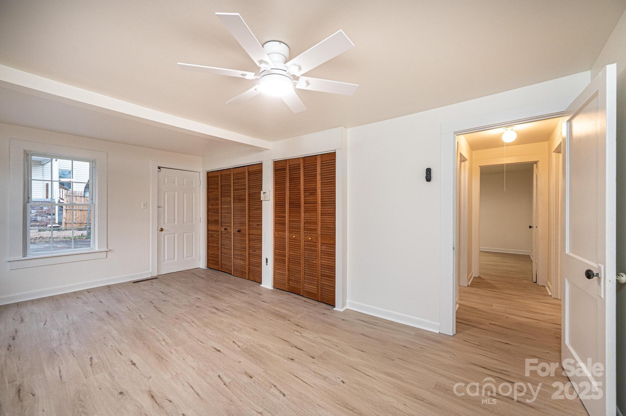 80 Duke Street Granite Falls, NC 28630 - Photo 44 of 48 a view of an empty room with wooden floor and a window