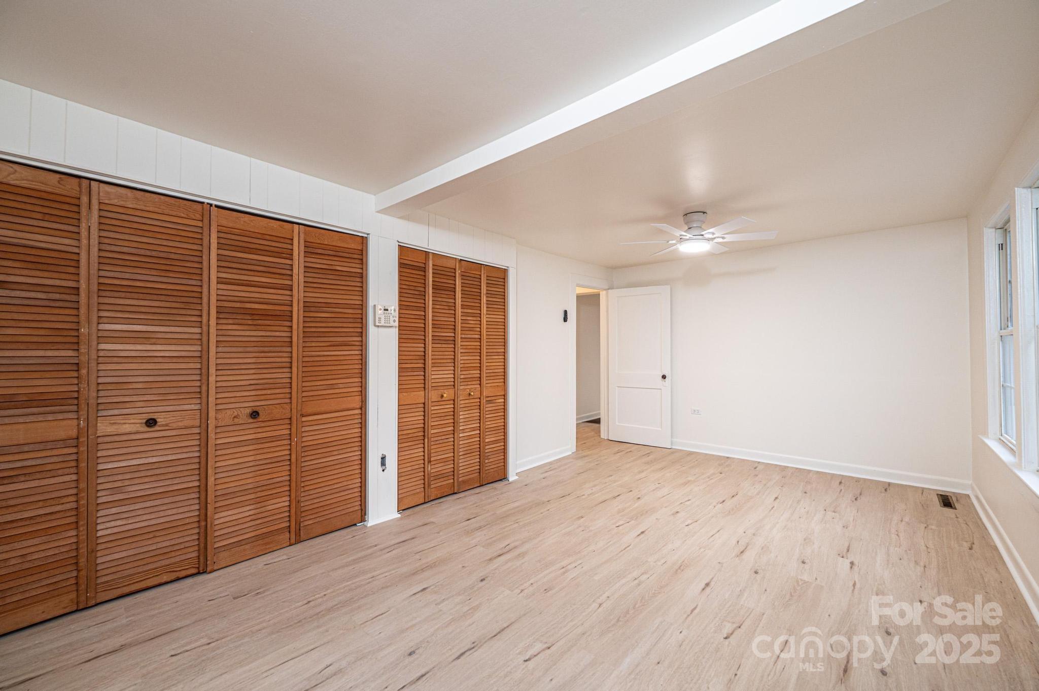 80 Duke Street Granite Falls, NC 28630 - Photo 45 of 48 wooden floor in an empty room with a window
