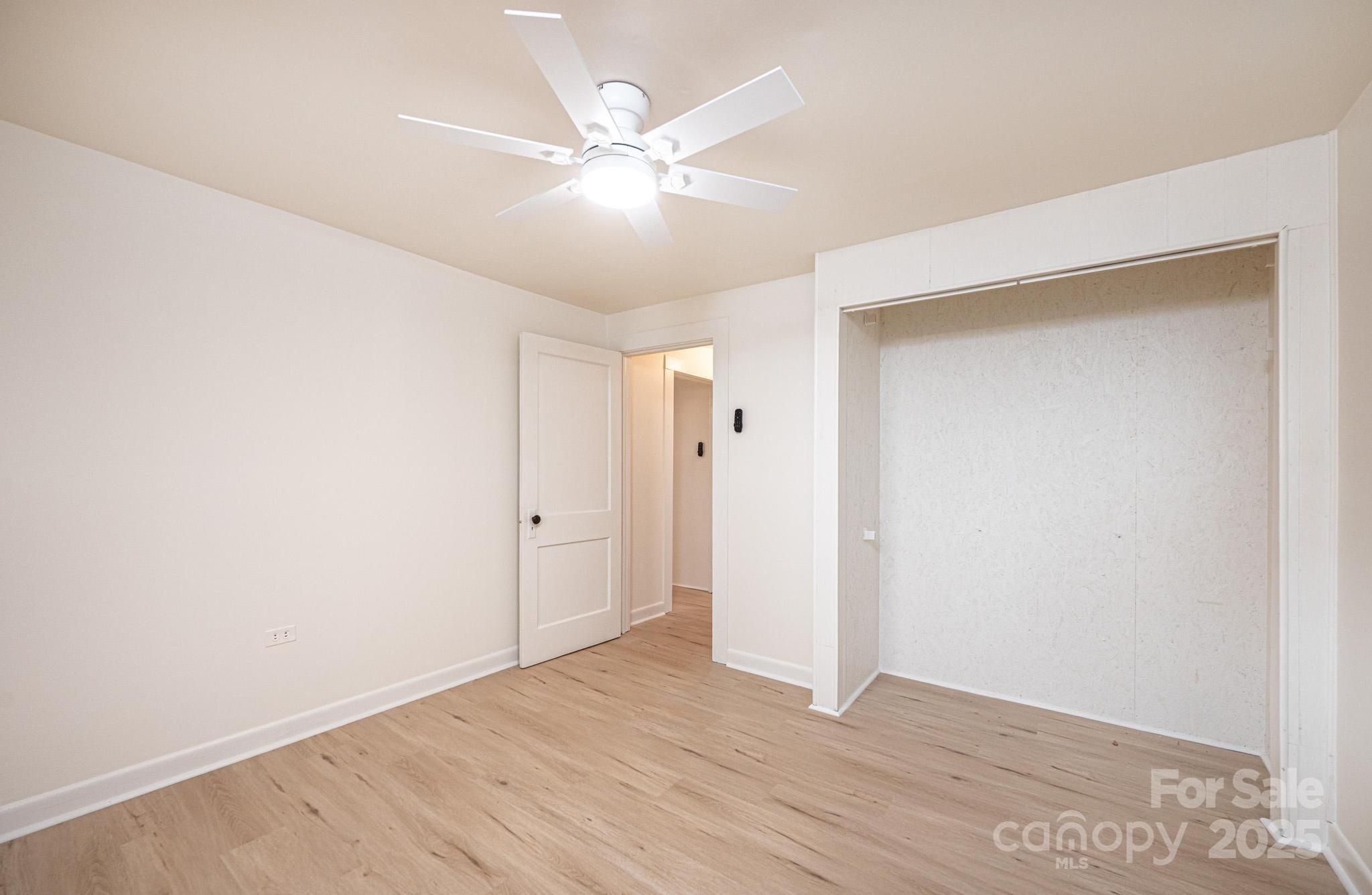 80 Duke Street Granite Falls, NC 28630 - Photo 48 of 48 an empty room with wooden floor and fan