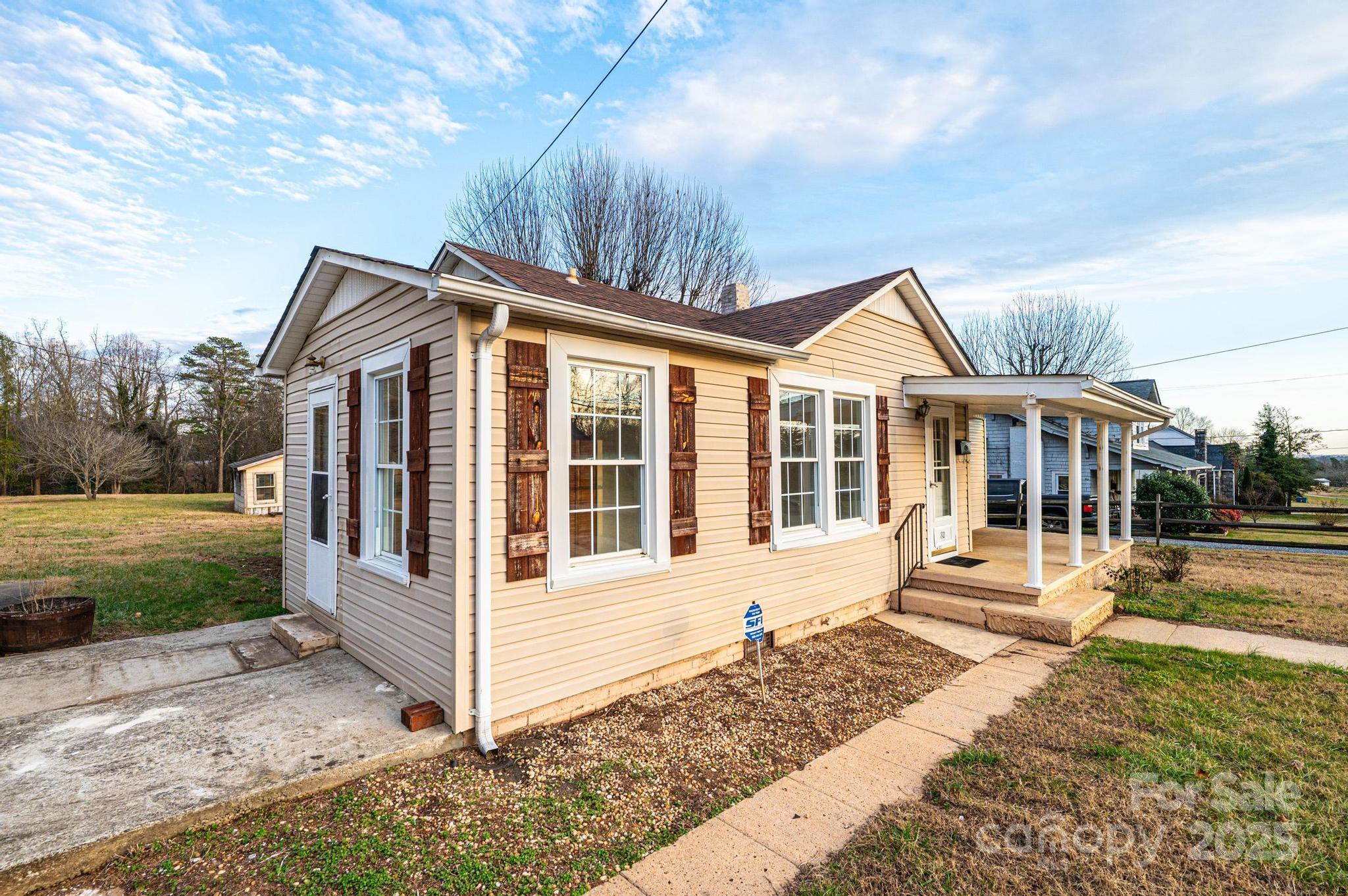 80 Duke Street Granite Falls, NC 28630 - Photo 9 of 48 a front view of a house with a yard