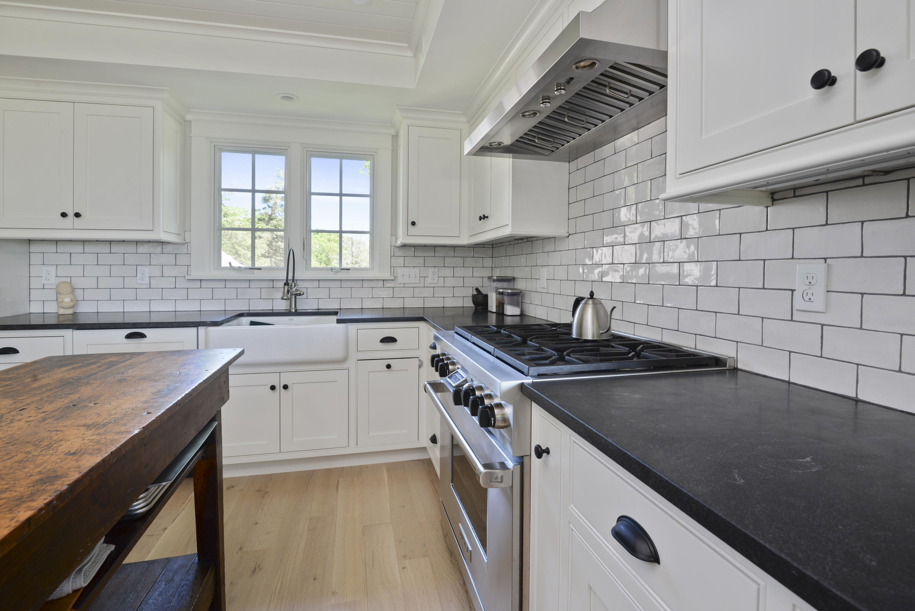 84 Old Dock Road Falmouth, MA 02540 - Photo 14 of 36 a kitchen with a sink stove top oven and cabinets