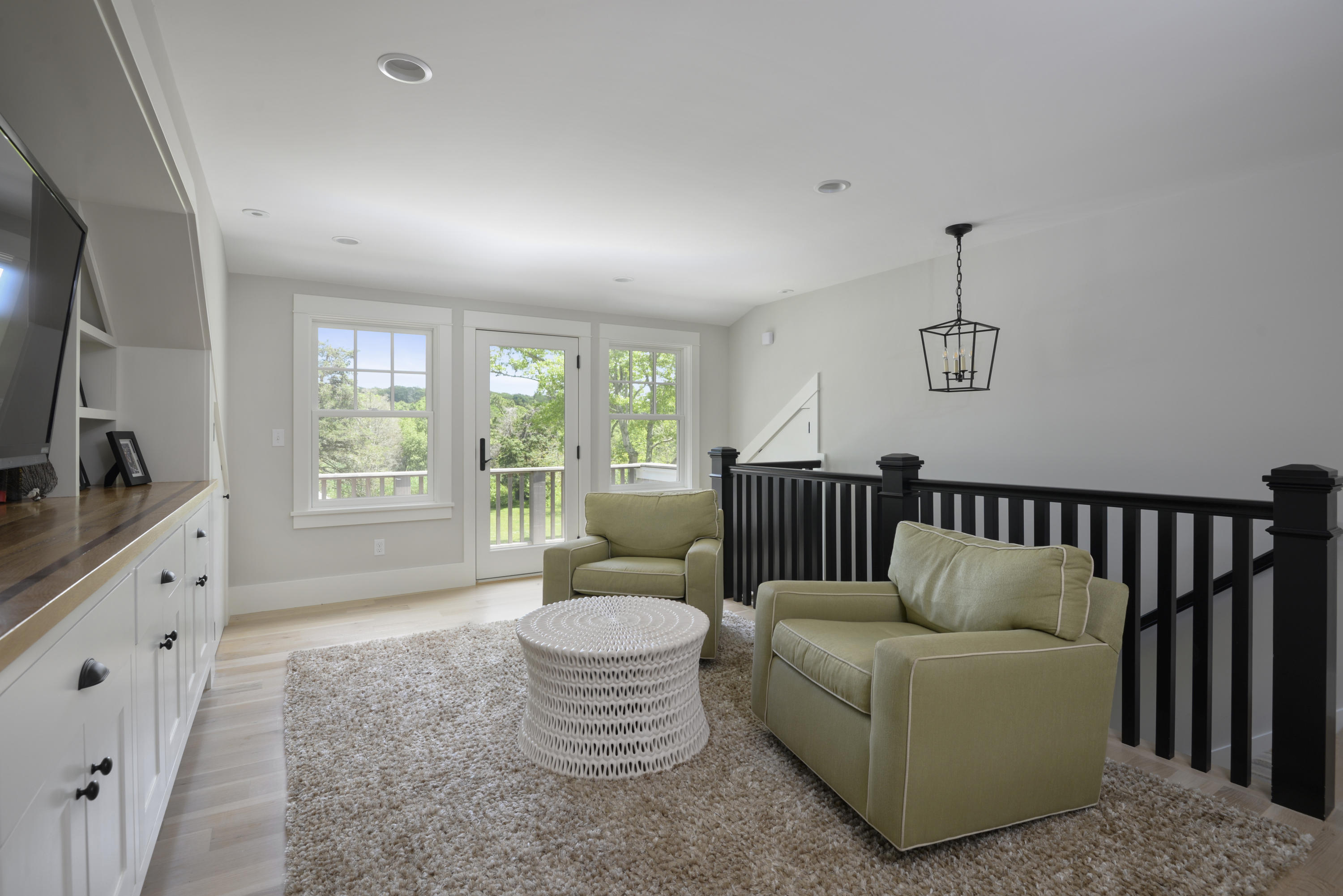 84 Old Dock Road Falmouth, MA 02540 - Photo 19 of 36 a living room with furniture a flat screen tv and a large window