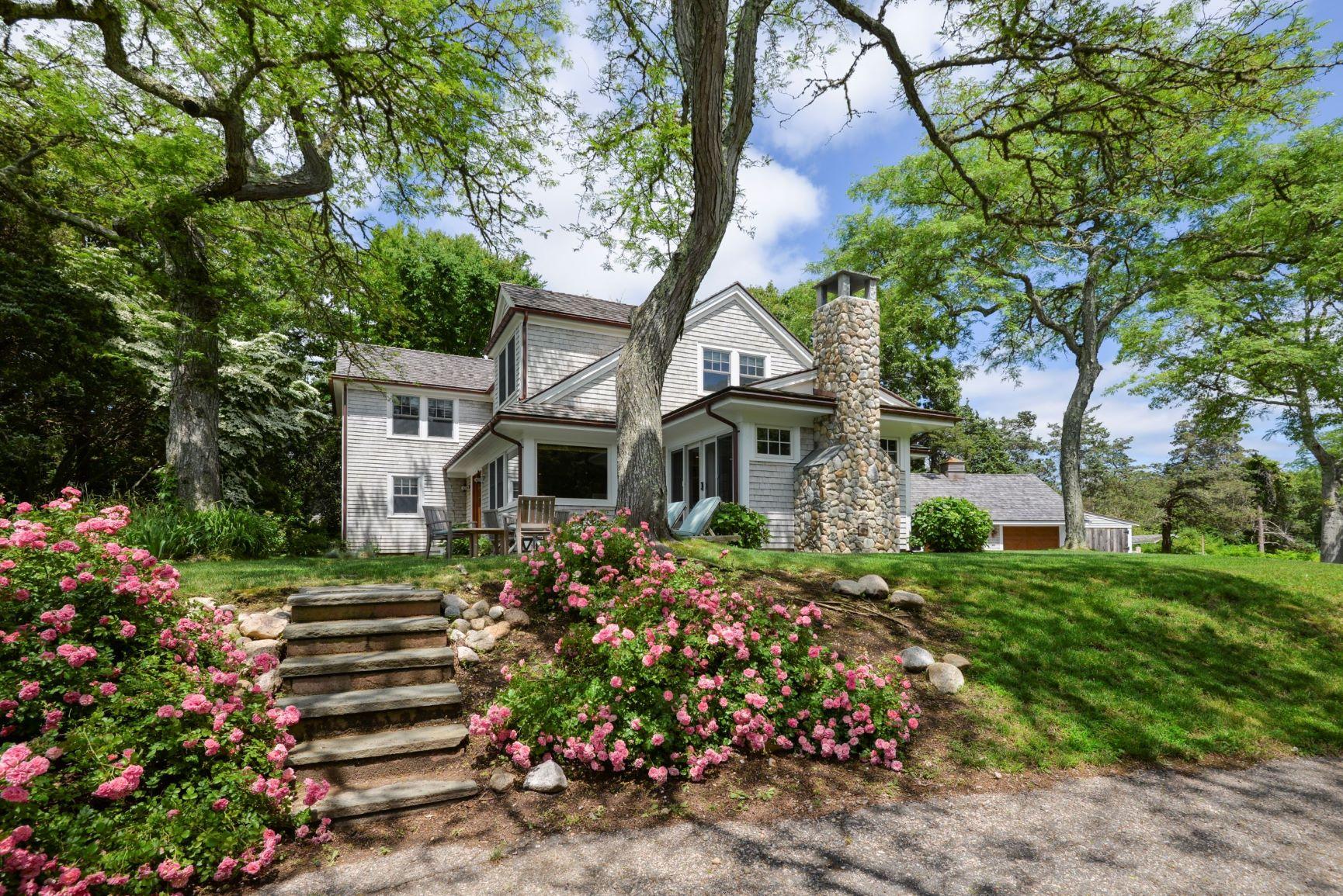 84 Old Dock Road Falmouth, MA 02540 - Photo 2 of 36 a front view of a house with a garden