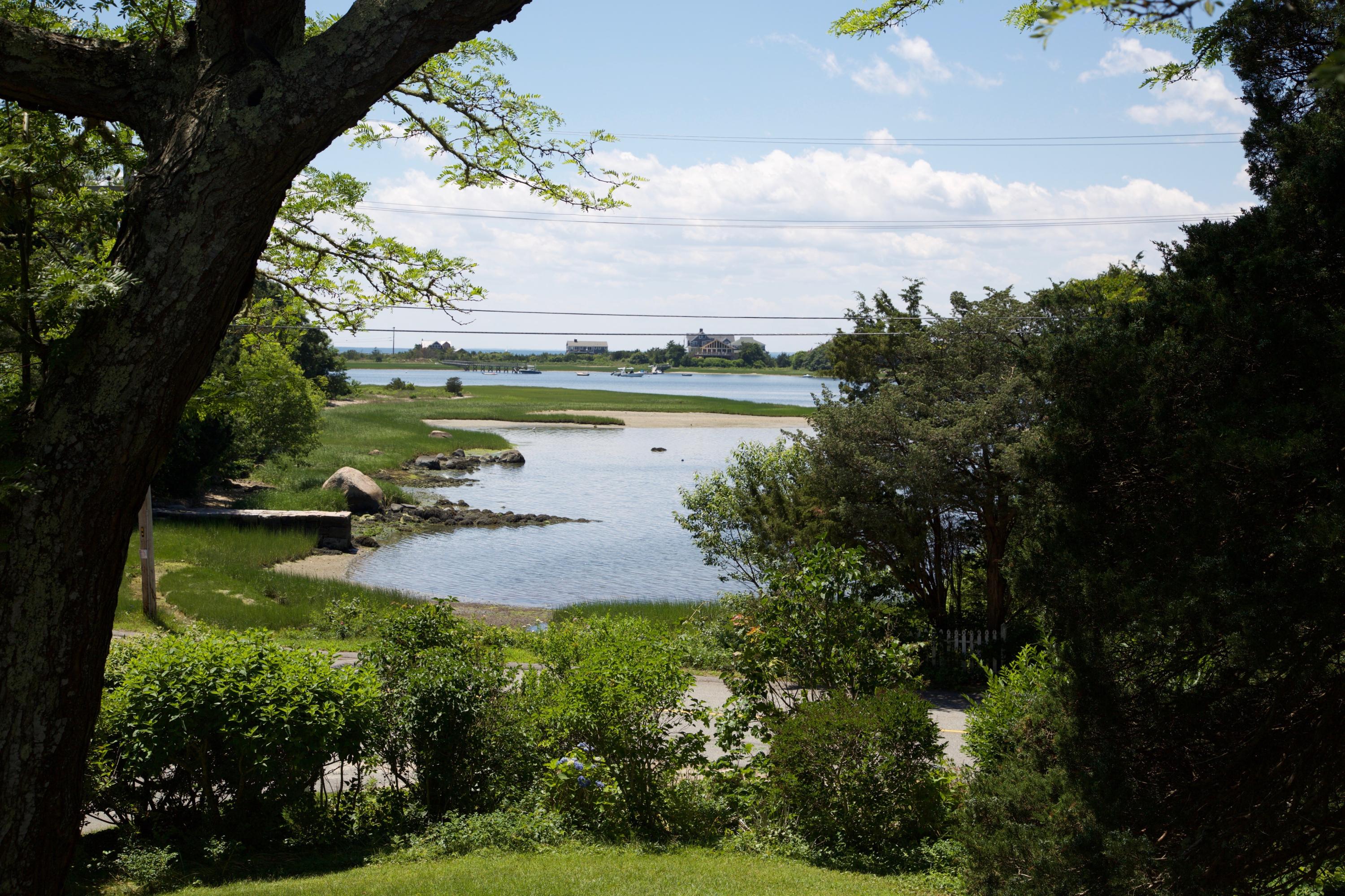84 Old Dock Road Falmouth, MA 02540 - Photo 5 of 36 a view of a lake from a yard
