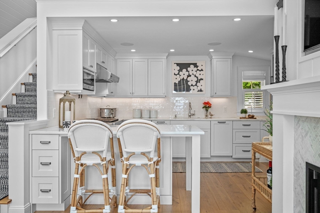 31 Franklin Street Marblehead, MA 01945 - Photo 14 of 35 a kitchen with stainless steel appliances kitchen island granite countertop a refrigerator and cabinets
