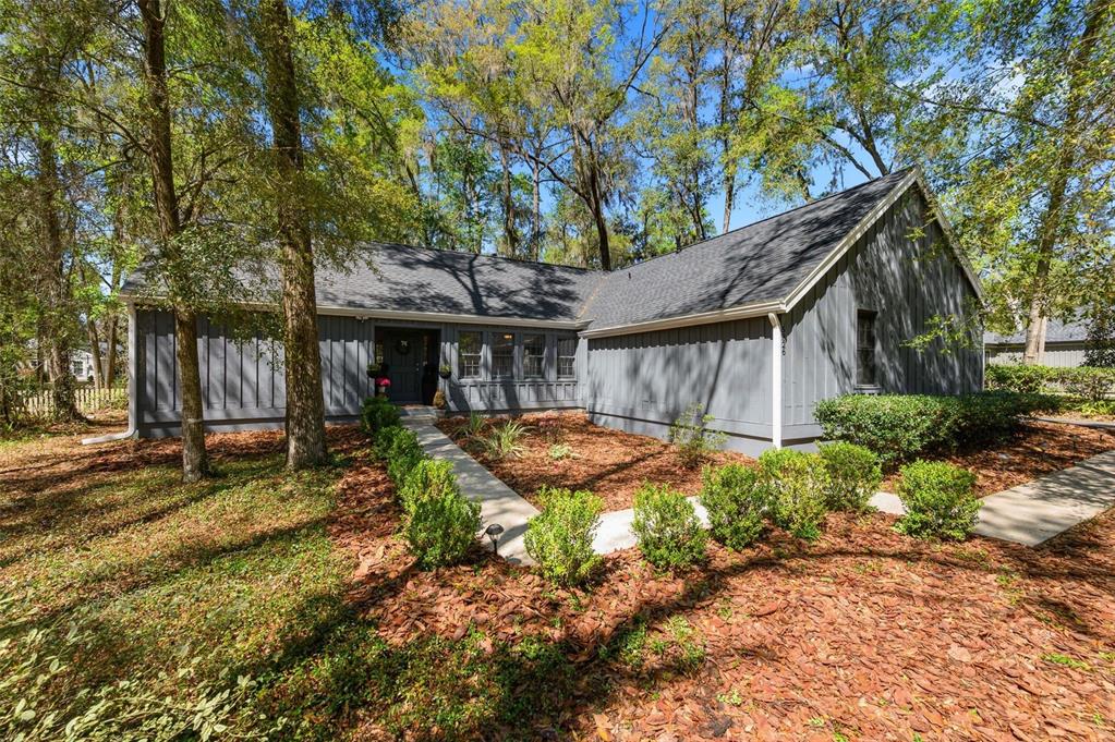 5326 Southwest 83 Terrace Gainesville, FL 32608 - Photo 1 of 40 a view of a house with backyard and sitting area
