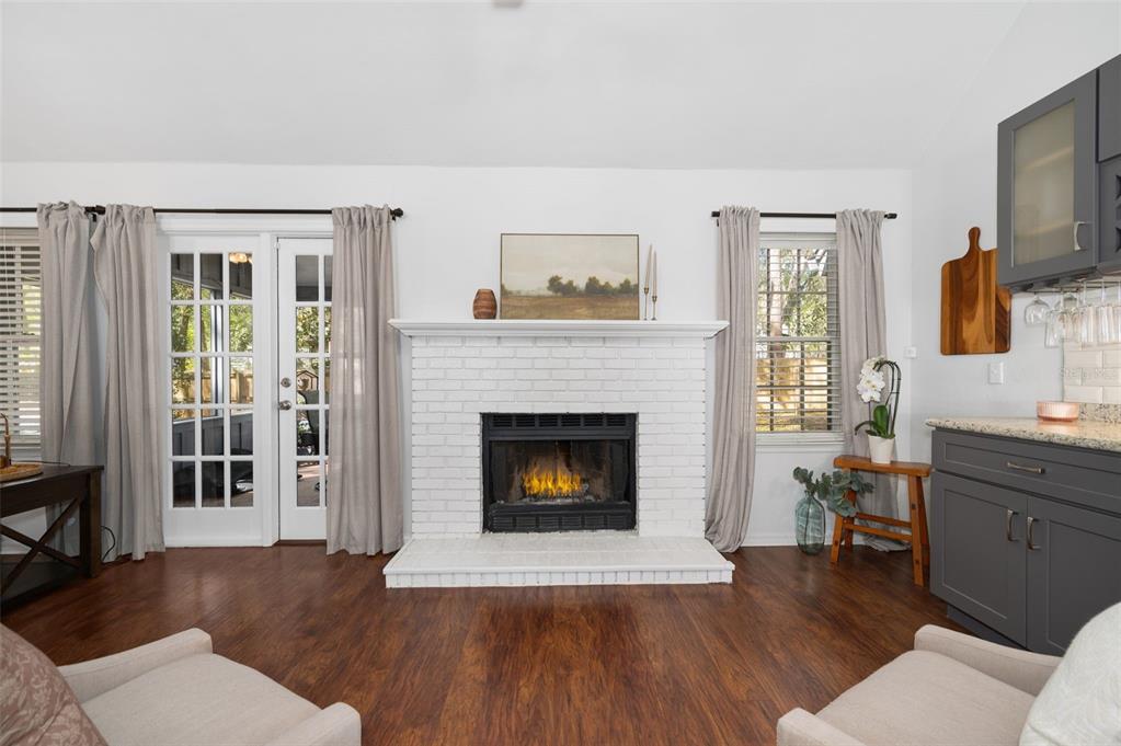 5326 Southwest 83 Terrace Gainesville, FL 32608 - Photo 18 of 40 a living room with furniture and a fireplace