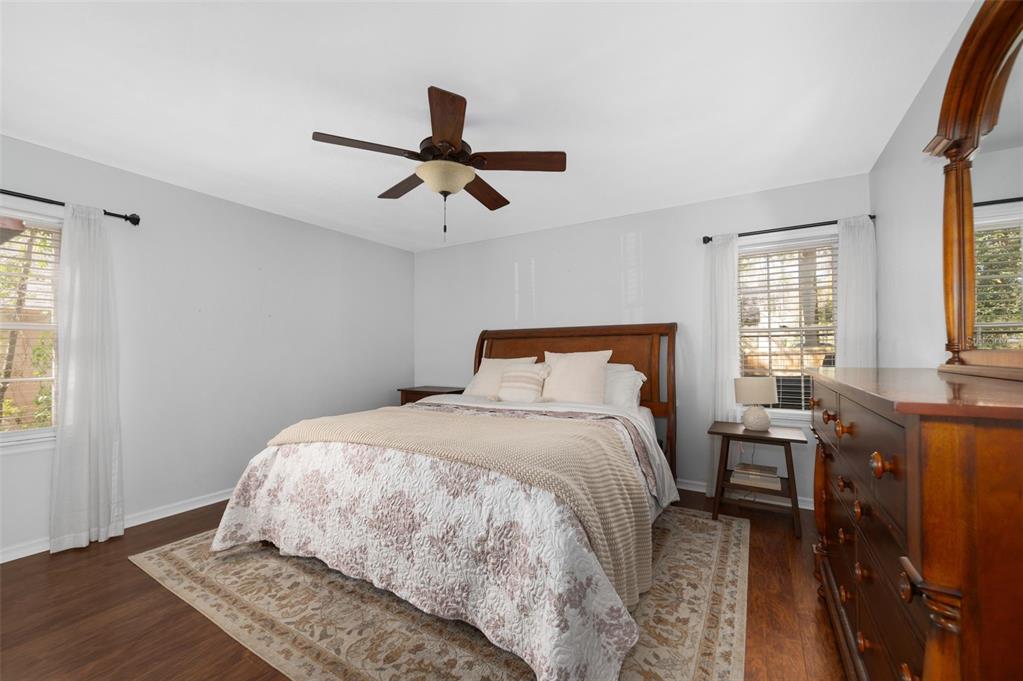 5326 Southwest 83 Terrace Gainesville, FL 32608 - Photo 19 of 40 a bedroom with a bed and wooden floor