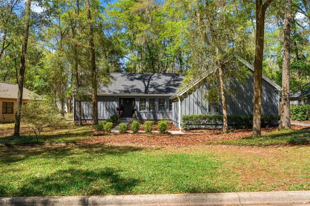 5326 Southwest 83 Terrace Gainesville, FL 32608 - Photo 2 of 40 front view of a house with a yard