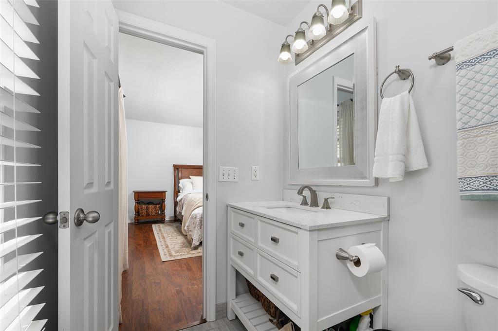 5326 Southwest 83 Terrace Gainesville, FL 32608 - Photo 23 of 40 a bathroom with a sink vanity toilet and shower