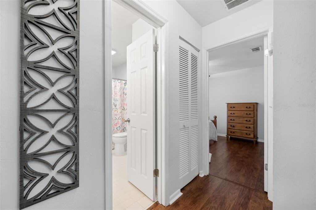 5326 Southwest 83 Terrace Gainesville, FL 32608 - Photo 26 of 40 a view of a hallway with wooden floor and closet