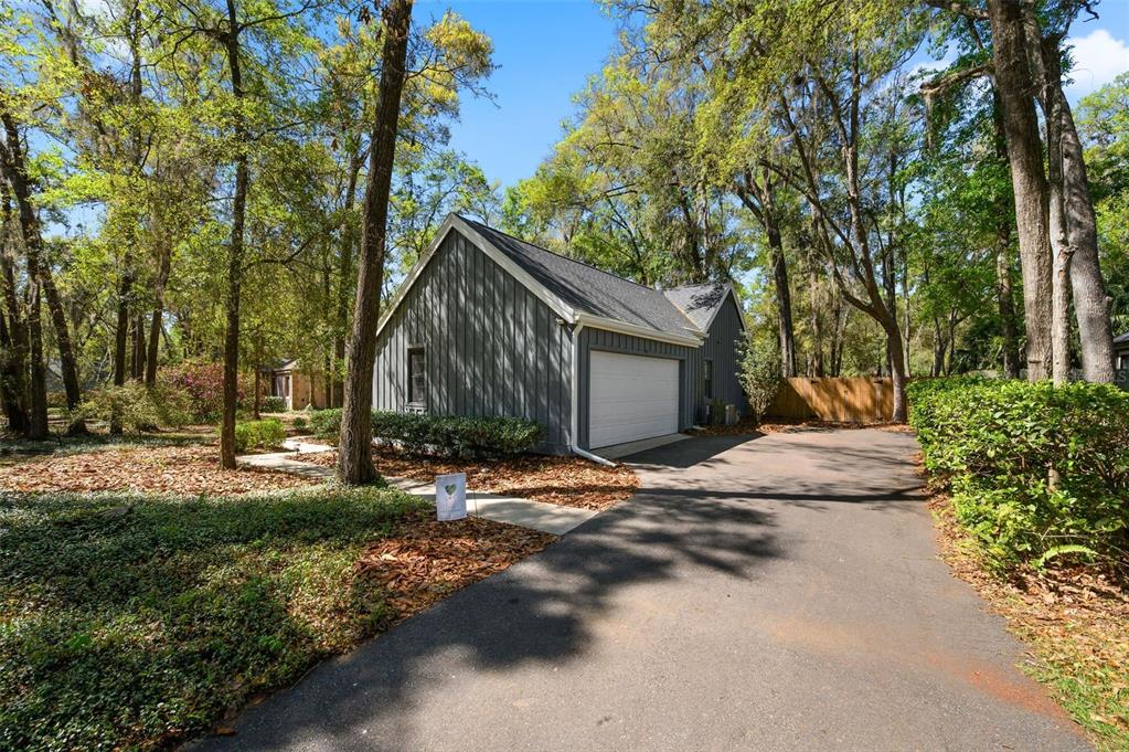 5326 Southwest 83 Terrace Gainesville, FL 32608 - Photo 4 of 40 a view of a house with backyard and trees