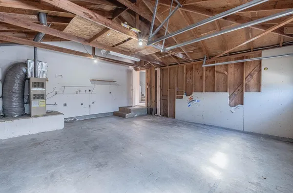 a view of a backyard with wooden fence