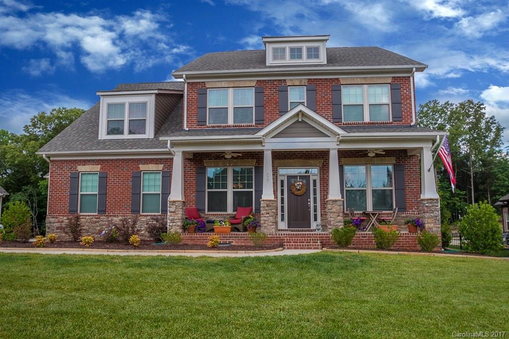 8037 Clems Branch Road, Unit 137 Indian Land, SC 29707 - Photo 1 of 24 a front view of a house with a yard