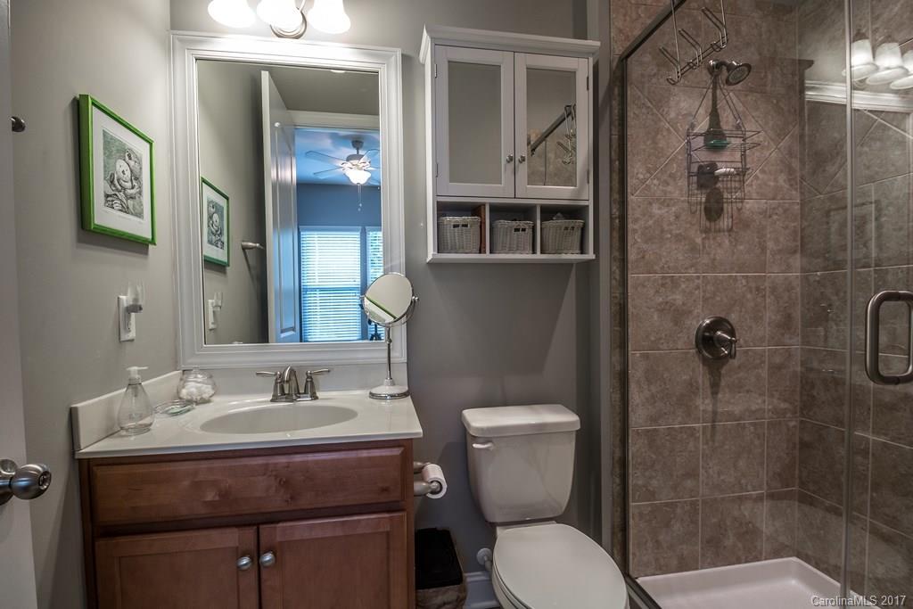 8037 Clems Branch Road, Unit 137 Indian Land, SC 29707 - Photo 12 of 24 a bathroom with a sink toilet and shower