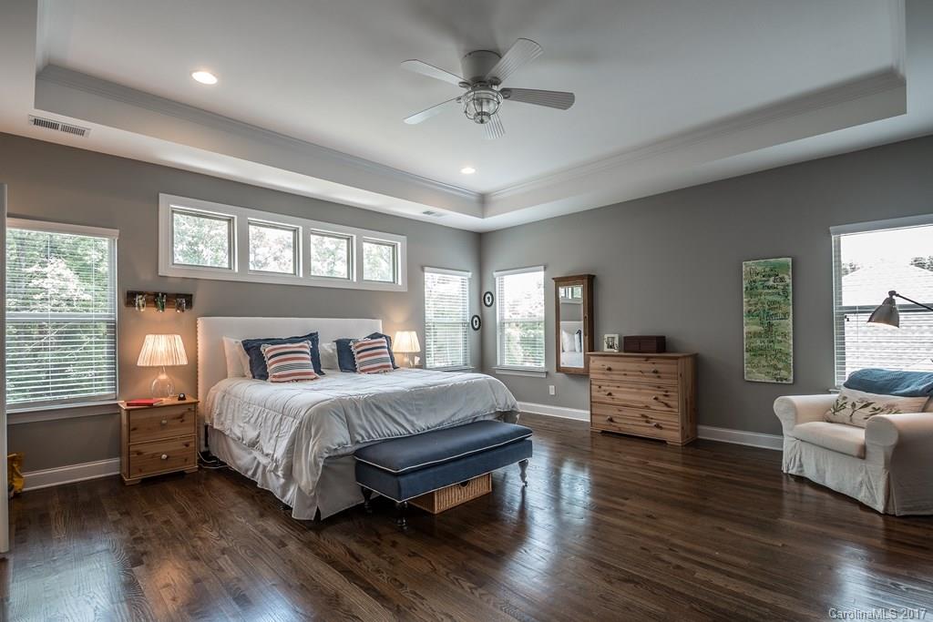 8037 Clems Branch Road, Unit 137 Indian Land, SC 29707 - Photo 14 of 24 a bedroom with a bed and wooden floor