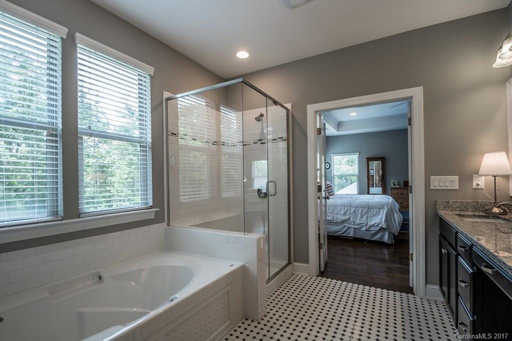 8037 Clems Branch Road, Unit 137 Indian Land, SC 29707 - Photo 16 of 24 a en suite spacious bathroom with a tub shower and windows