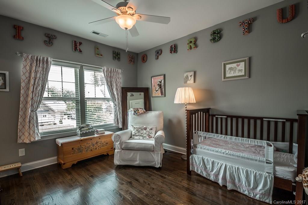 8037 Clems Branch Road, Unit 137 Indian Land, SC 29707 - Photo 18 of 24 a bedroom with furniture and a window