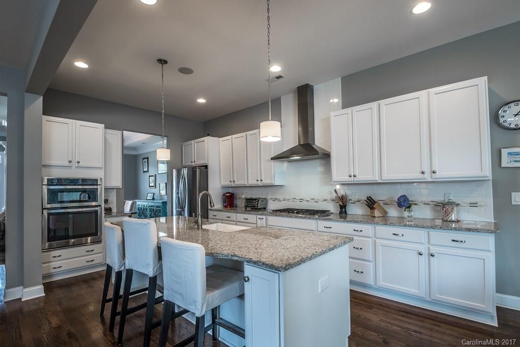 8037 Clems Branch Road, Unit 137 Indian Land, SC 29707 - Photo 3 of 24 a kitchen with a sink window and cabinets