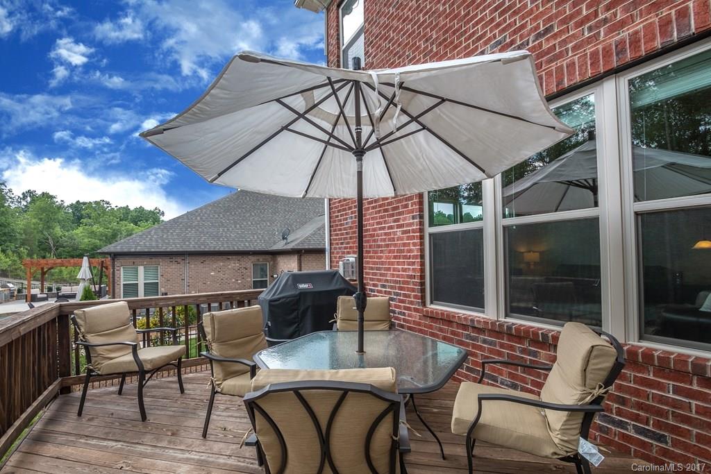 8037 Clems Branch Road, Unit 137 Indian Land, SC 29707 - Photo 22 of 24 a patio with a table and chairs
