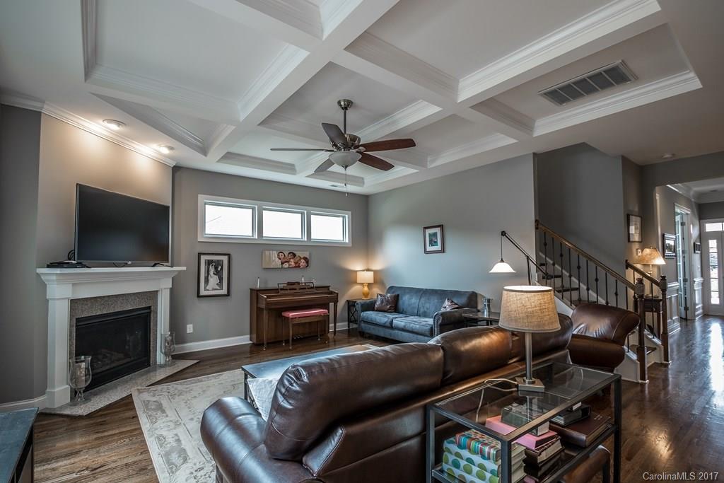 8037 Clems Branch Road, Unit 137 Indian Land, SC 29707 - Photo 5 of 24 a living room with furniture a fireplace and a flat screen tv