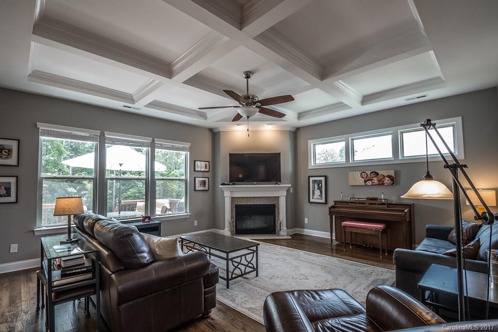 8037 Clems Branch Road, Unit 137 Indian Land, SC 29707 - Photo 6 of 24 a living room with furniture a fireplace and a flat screen tv