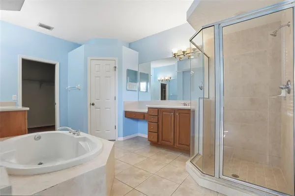 a bathroom with a bathtub and a sink