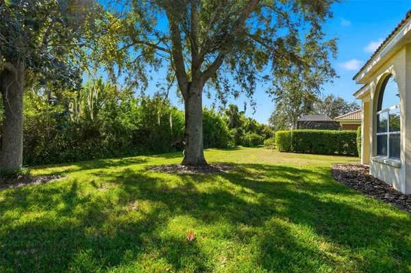a view of a patio and a yard