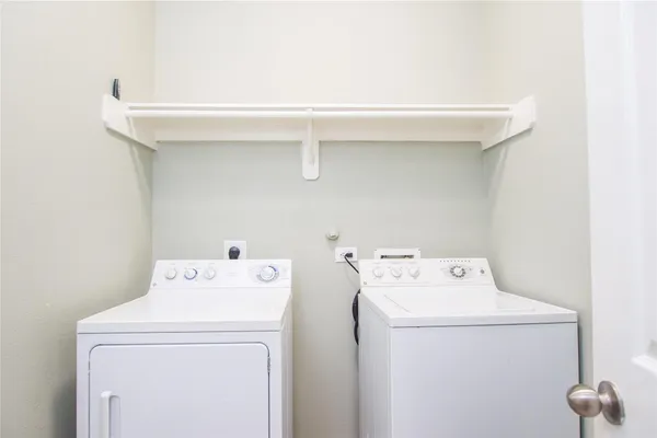 a utility room with dryer and washer