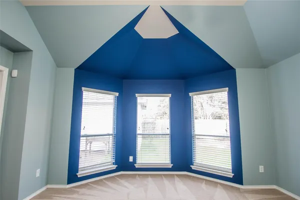 a view of an empty room and window