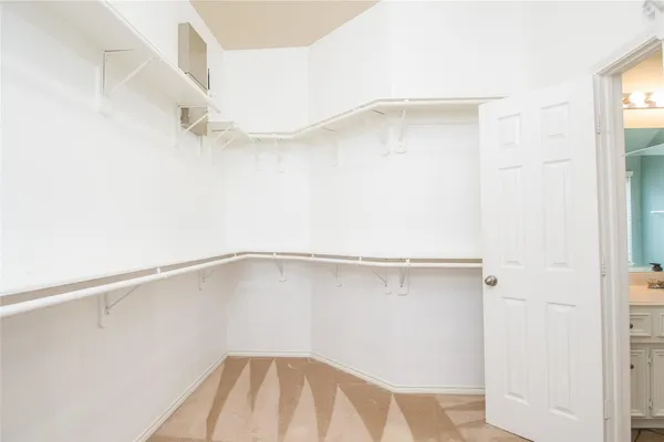 a view of an empty walk in closet