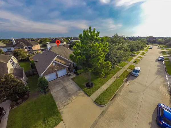 an aerial view of a house with a garden