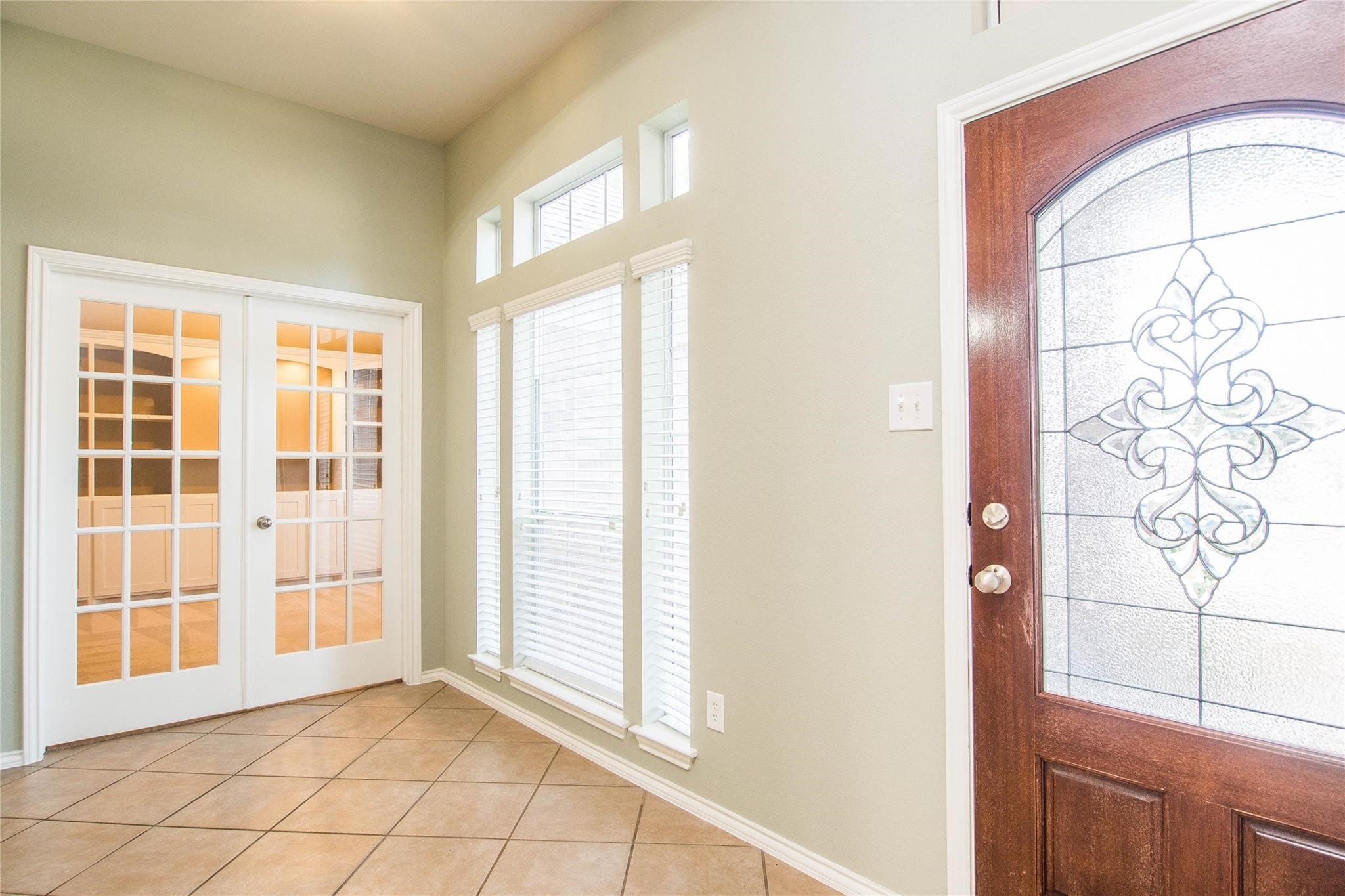 8847 Distant Woods Drive Houston, TX 77095 - Photo 5 of 26 a view of an empty room with a window