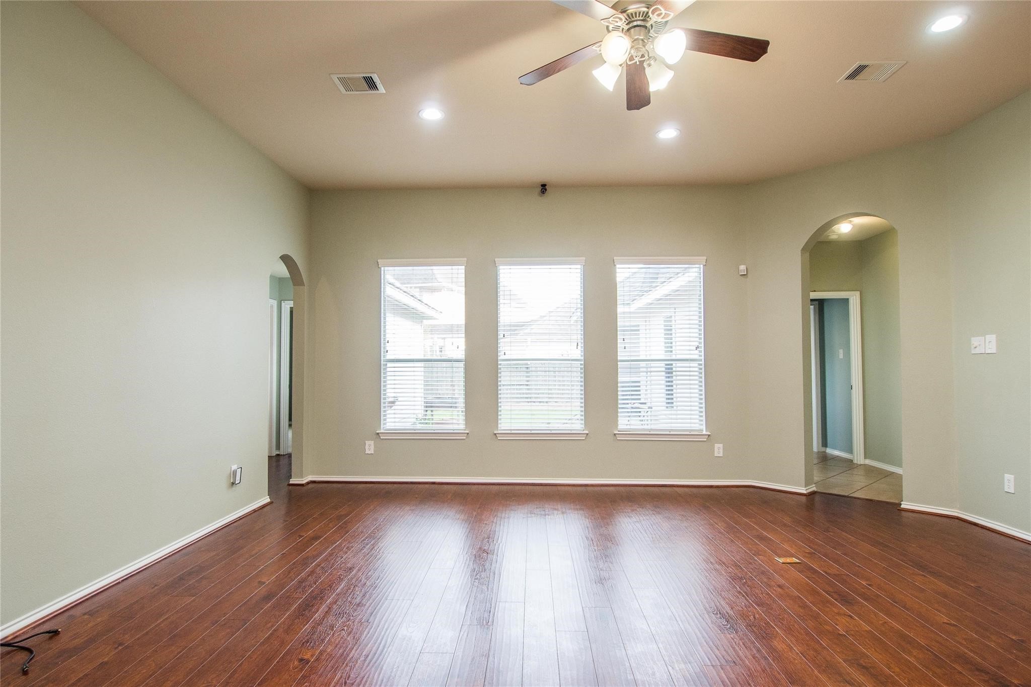 8847 Distant Woods Drive Houston, TX 77095 - Photo 10 of 26 a view of an empty room with wooden floor and a window