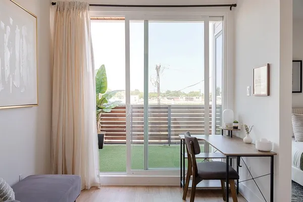 a view of a room with a window and dining room