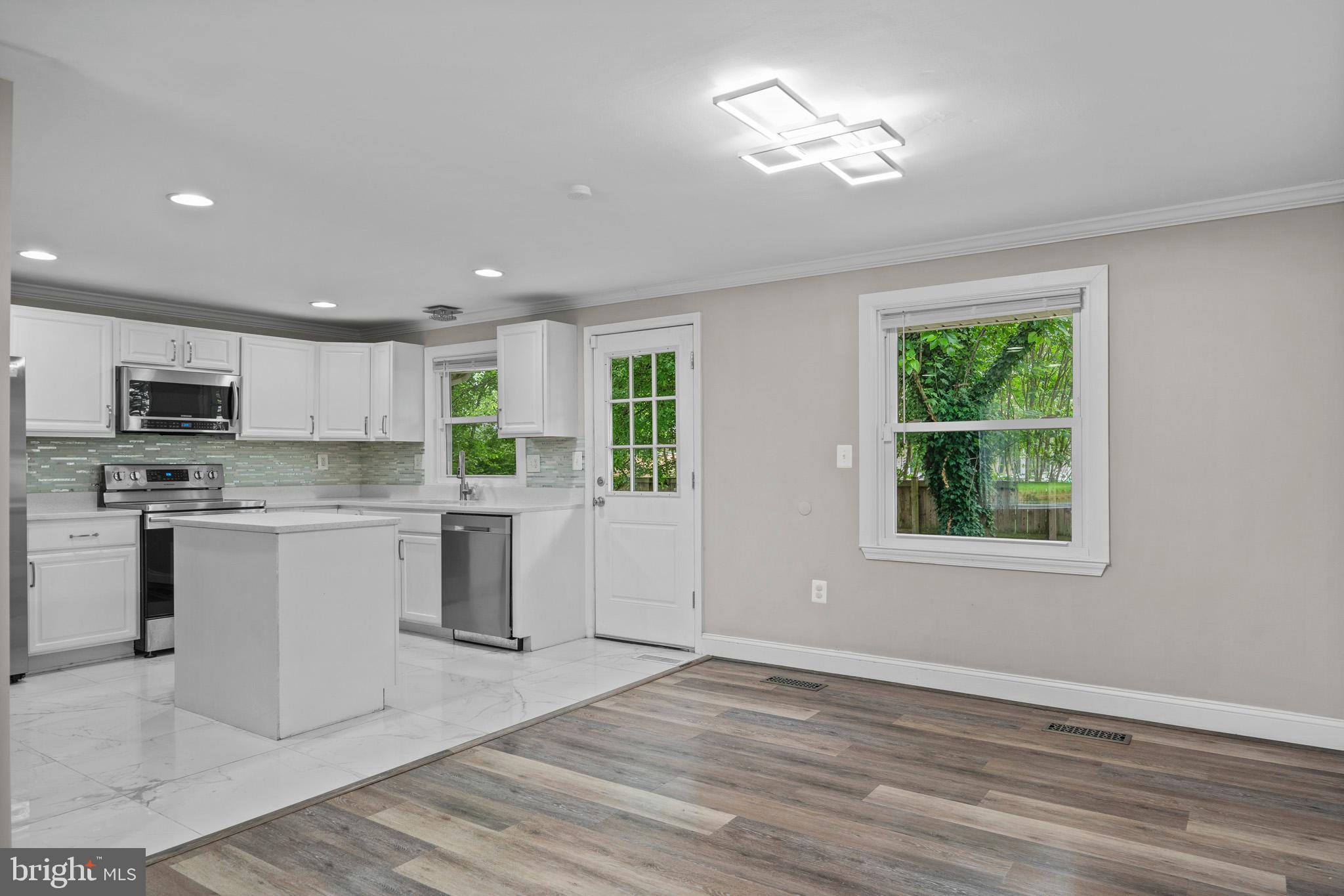 5908 Michael Road Waldorf, MD 20601 - Photo 19 of 44 a kitchen with a refrigerator and microwave
