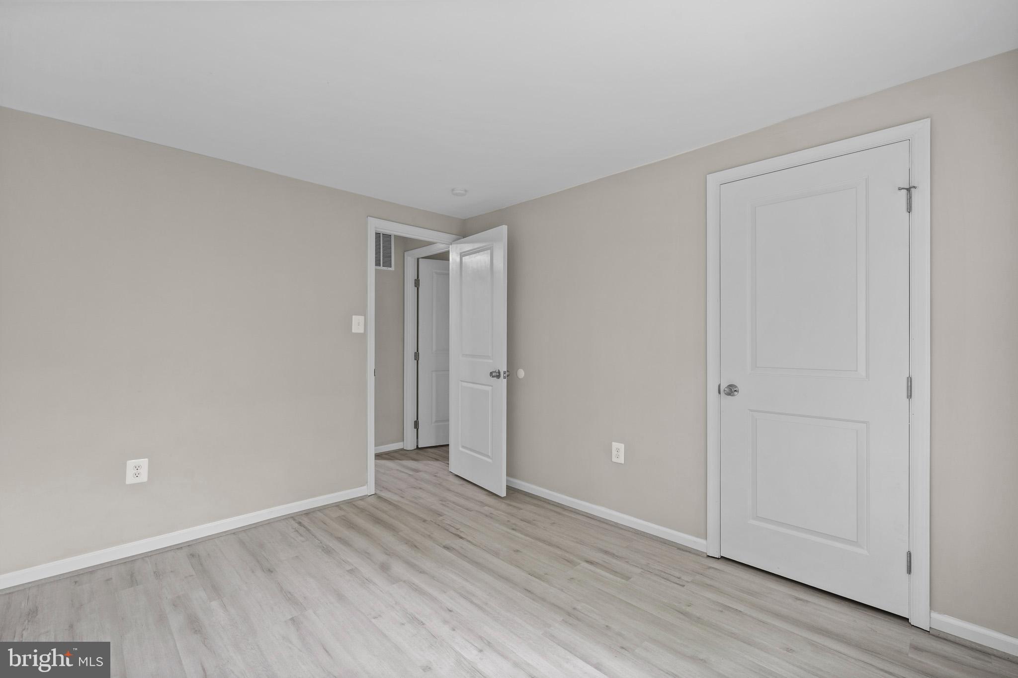5908 Michael Road Waldorf, MD 20601 - Photo 24 of 44 a view of an empty room and wooden floor