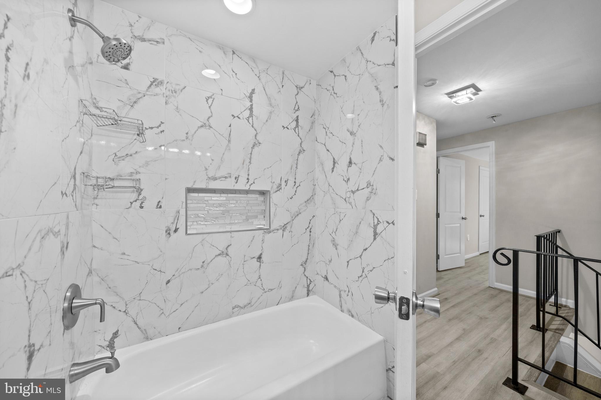 5908 Michael Road Waldorf, MD 20601 - Photo 29 of 44 a bathroom with a bathtub and shower
