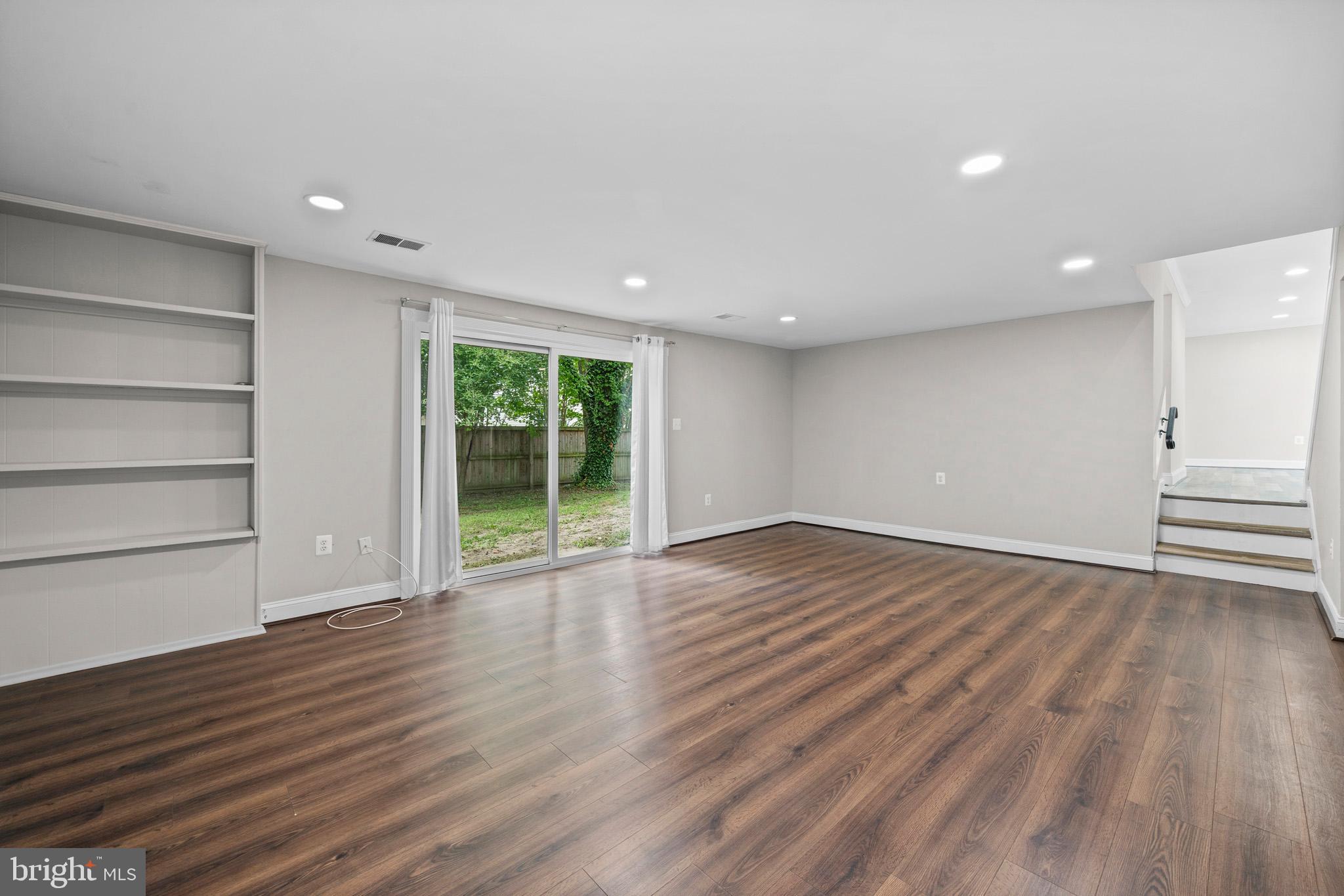 5908 Michael Road Waldorf, MD 20601 - Photo 30 of 44 a view of an empty room with wooden floor and window